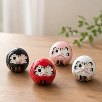 Figurine daruma porte-bonheur en porcelaine