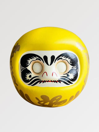 Daruma traditionnel jaune en céramique
